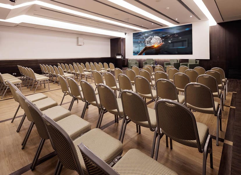 Hotel Universo theater-style meeting room with AV projection for corporate conferences and events.