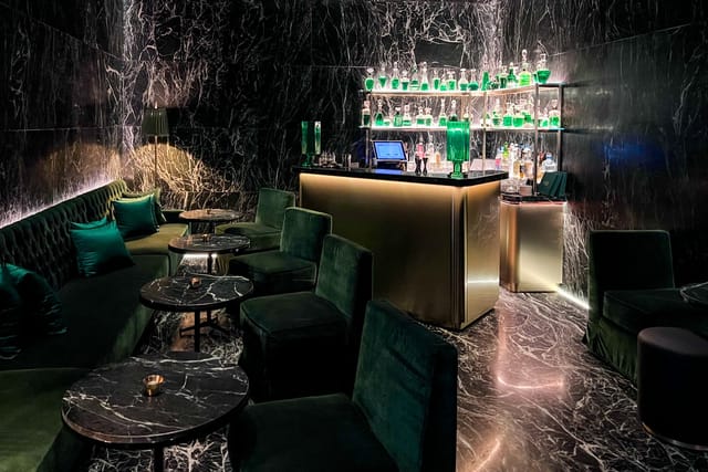 Jade Bar luxury VIP lounge with velvet seating for exclusive networking events.