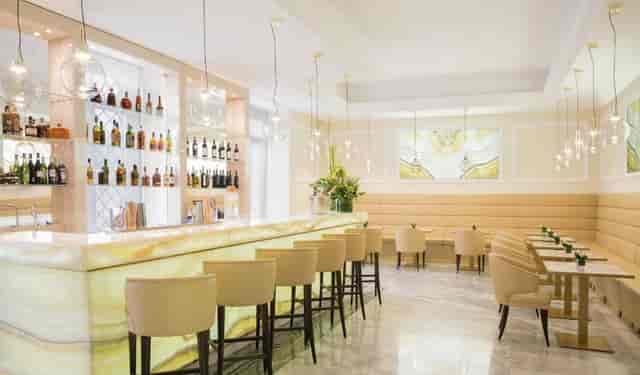Upscale lounge at Aleph Rome Hotel with ambient lighting for executive receptions and networking.
