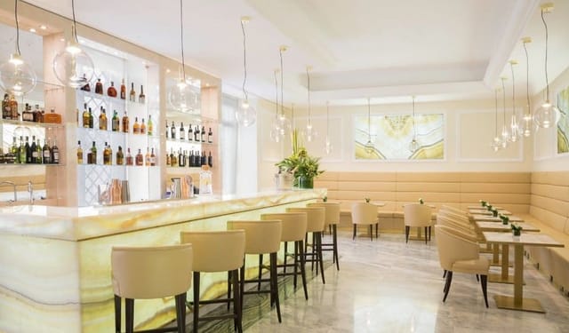 Upscale lounge at Aleph Rome Hotel with ambient lighting for executive receptions and networking.
