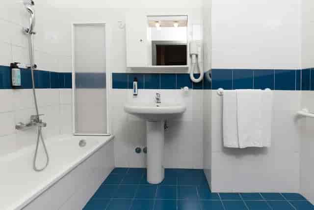 ADA-compliant hotel bathroom at Villa Eur, functional event lodging design.