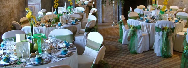 Conference hall at Congressi Rospigliosi with elegant green sash banquet setup for corporate events.