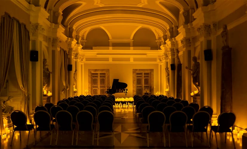 Elegant candle-lit conference hall at Congressi Rospigliosi for upscale corporate event and recital.