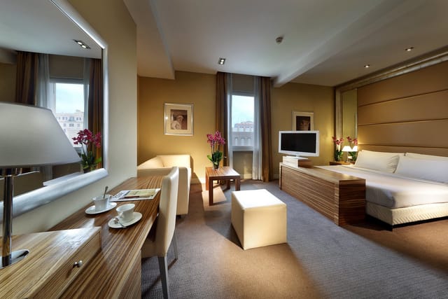 Executive hotel meeting room with dedicated workspace for corporate events and business travel.