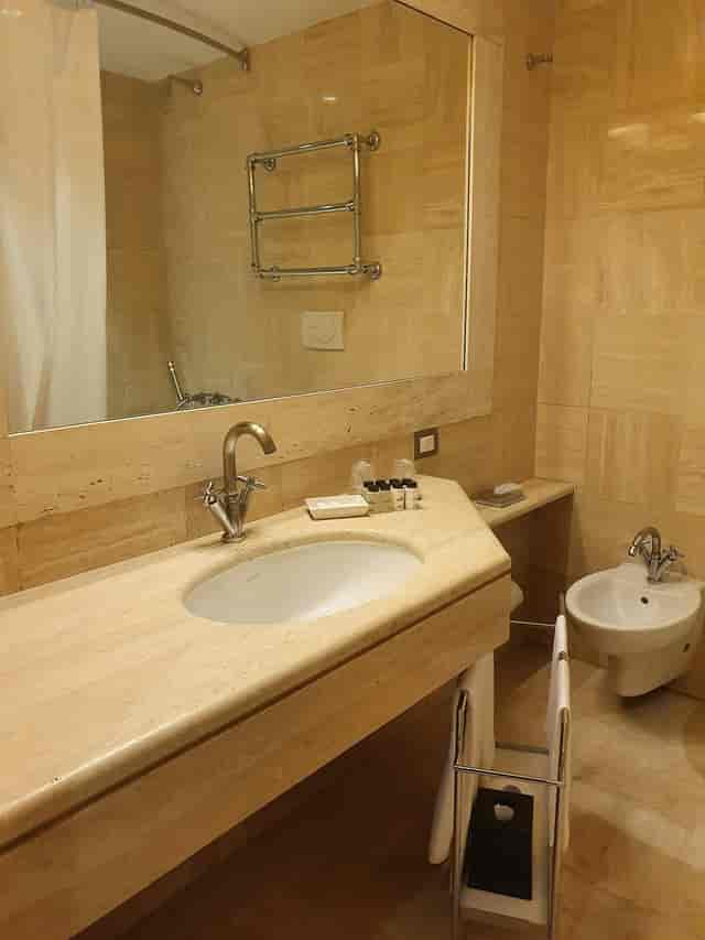 Sheraton Rome Parco de' Medici hotel bathroom, neutral design, corporate event accommodation.