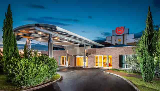Sheraton Rome hotel porte-cochère for VIP arrivals and corporate event logistics.