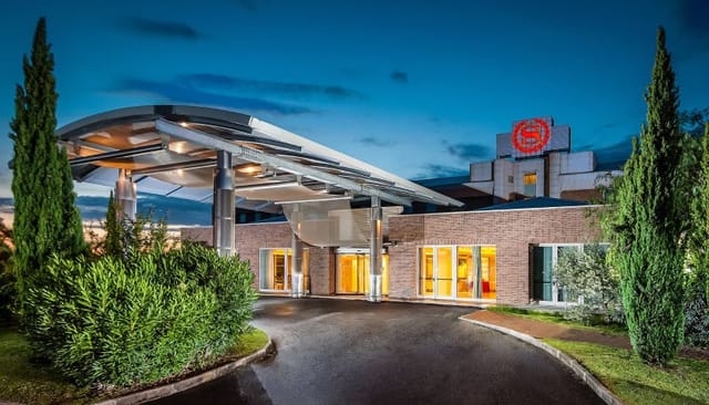 Sheraton Rome hotel porte-cochère for VIP arrivals and corporate event logistics.