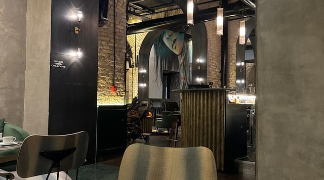 Industrial-chic Cafe in Chapter Roma with mural, ideal for exclusive networking reception events.