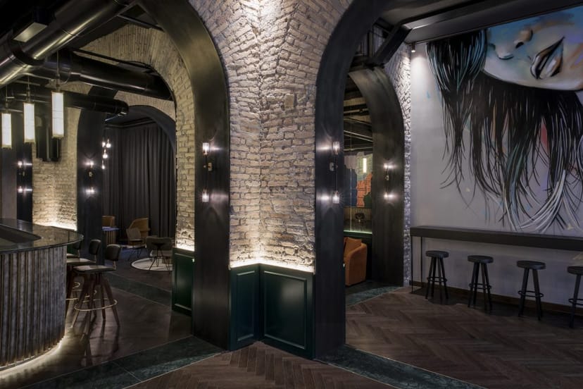 Industrial lobby venue with high-contrast decor for cocktail receptions and networking events.