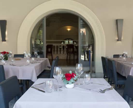 Gourmand's Restaurant: elegant table settings for corporate dinners and VIP events.