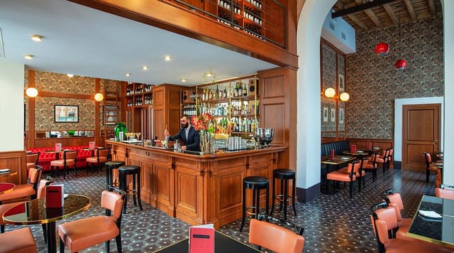 Sophisticated hotel lounge bar with plush banquettes for corporate events and VIP receptions.