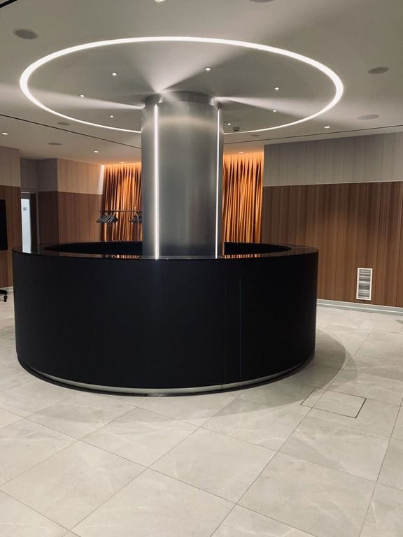 Modern circular registration desk in Hotel St. Martin foyer for corporate event and conference.