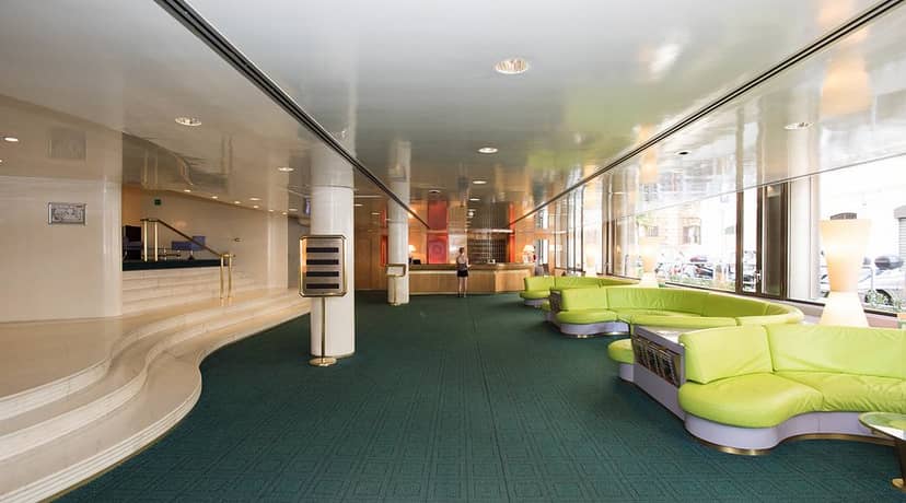 Hotel Albani Roma lobby interior featuring segmented seating, ideal for events and conferences.