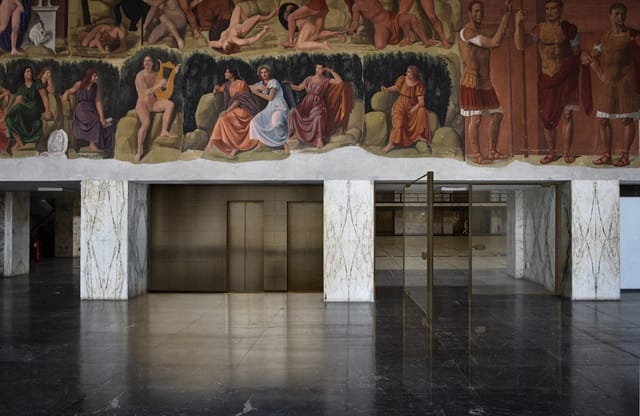 Historic Foyer Kennedy at Palazzo dei Congressi with grand murals for luxury event venue hire.