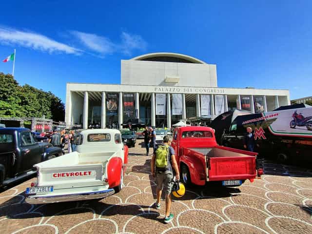 Palazzo dei Congressi auditorium façade hosting a branded vehicle showcase event.