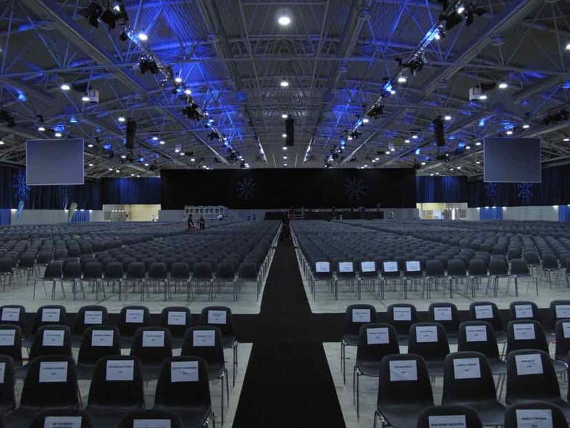 Fiera Roma conference hall featuring theater-style seating for large-scale plenary sessions.