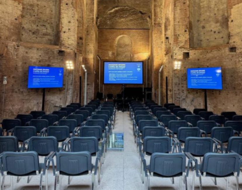 Modern AV setup in historic Great Hall Horti Sallustiani, corporate event venue.