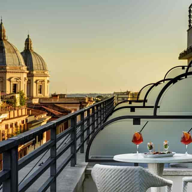 VIP rooftop cocktail reception at UNA HOTELS Decò Roma with iconic city views.