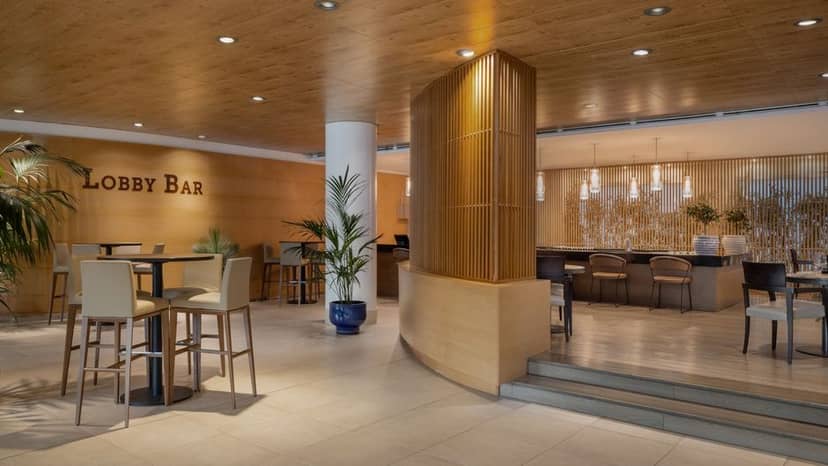 High-end lobby bar at Precise House Mantegna Roma for networking and corporate event breakout space.
