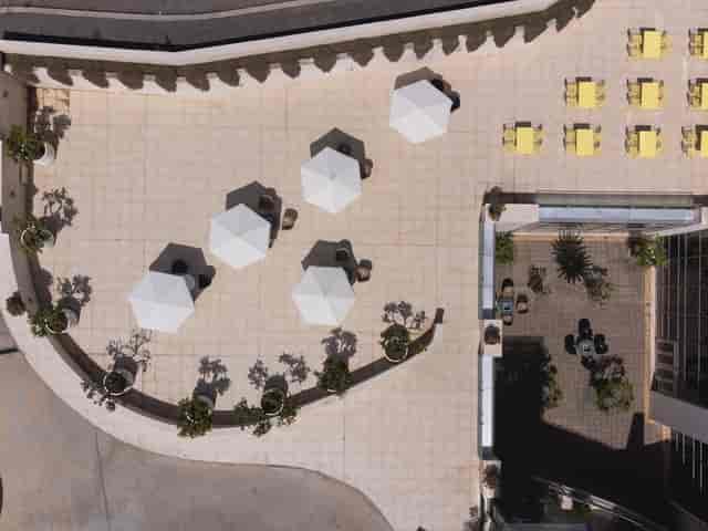 Rooftop auditorium venue with lounge seating for corporate breakout sessions and networking events.