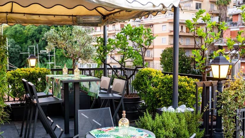 Ramo Bistrot rooftop networking event with ambient lighting and high-top tables.
