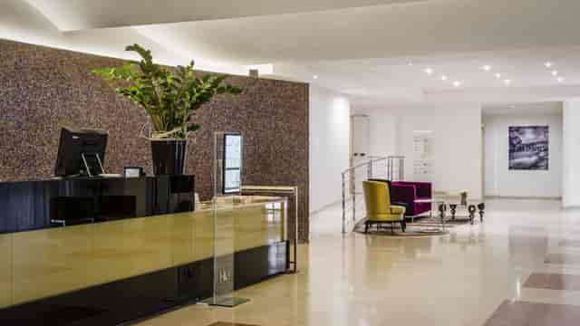 Modern hotel reception desk at Glass Convention Center for corporate event registration.
