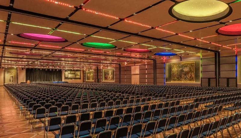 Theater-style ballroom at Radisson Blu Rome, modern AV setup for corporate conferences and events.