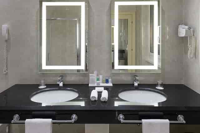 Double vanity in Radisson Blu GHR Hotel Rome, ideal for business travel and conference lodging.