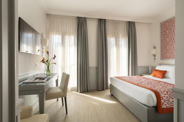 Luxury hotel suite with workspace for VIP event accommodation and group business bookings.