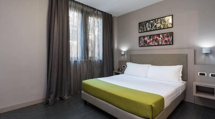 Noba Hotel suite with bedside power, ideal for corporate conferences and business travel.