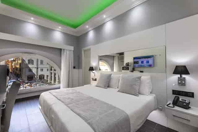 Modern hotel room with workspace for business travelers; ideal for corporate event room blocks.