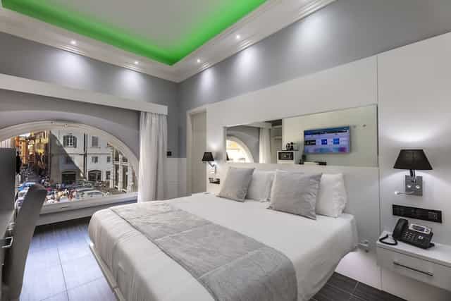 Modern hotel room with workspace for business travelers; ideal for corporate event room blocks.