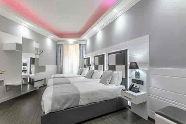 Triple-occupancy hotel guest room at THE ONE Boutique Hotel & SPA for conference group housing.