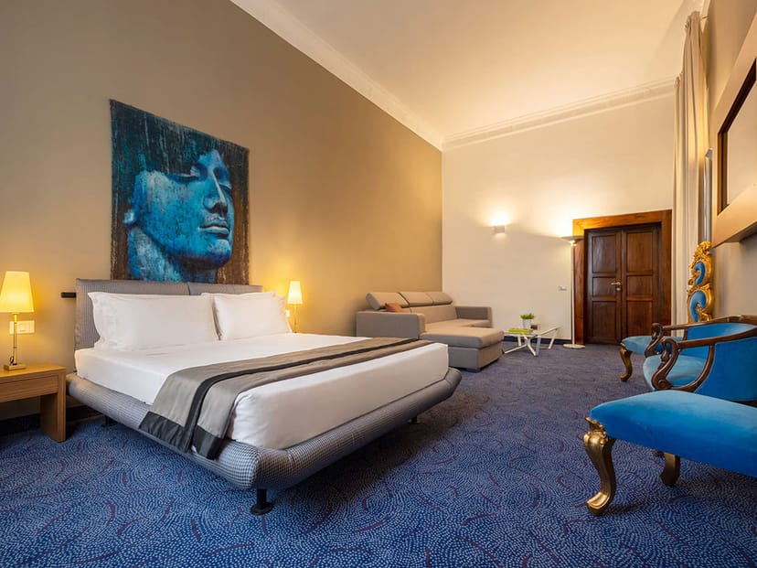 Luxury hotel suite with modern seating area for executive events and VIP speakers.