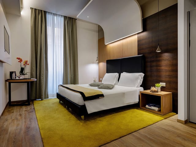 Modern hotel suite with workstation, ideal for executive travel and VIP room blocks.
