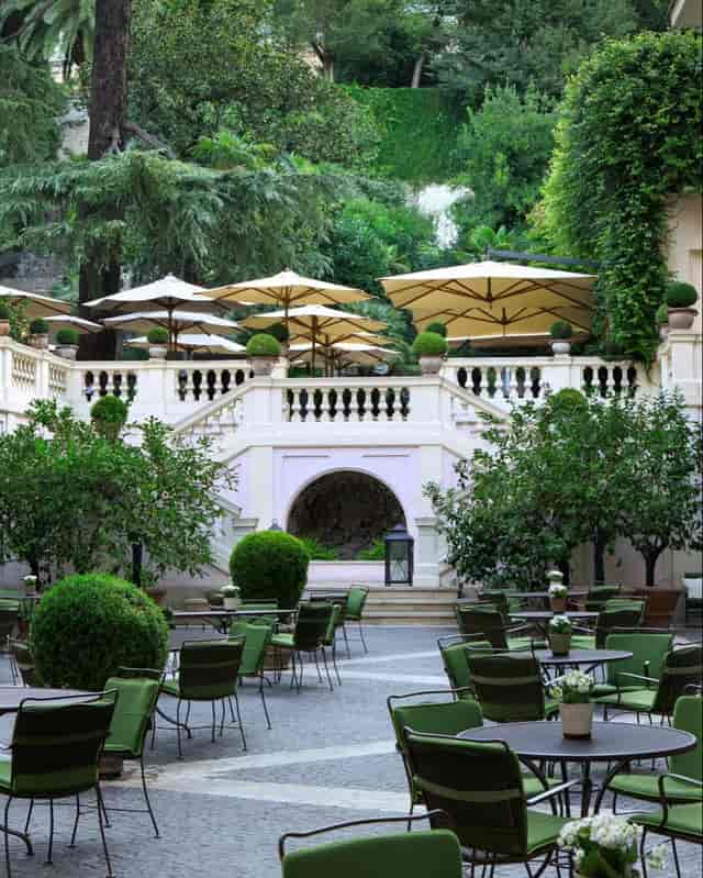 Tiered garden venue at Hotel de Russie for elegant cocktail receptions and networking mixers.