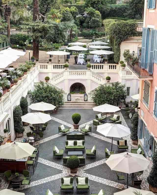 Hotel de Russie garden venue with grand staircase for corporate events and cocktail receptions.