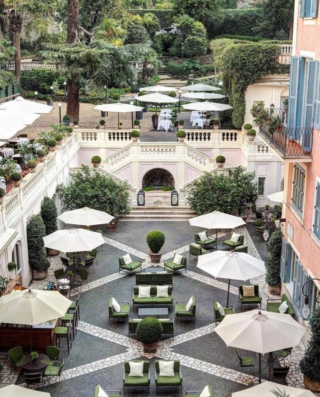 Hotel de Russie garden venue with grand staircase for corporate events and cocktail receptions.
