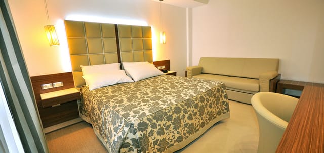 O.C. Hotel Roma conference room with floral decor for business events and corporate meetings.