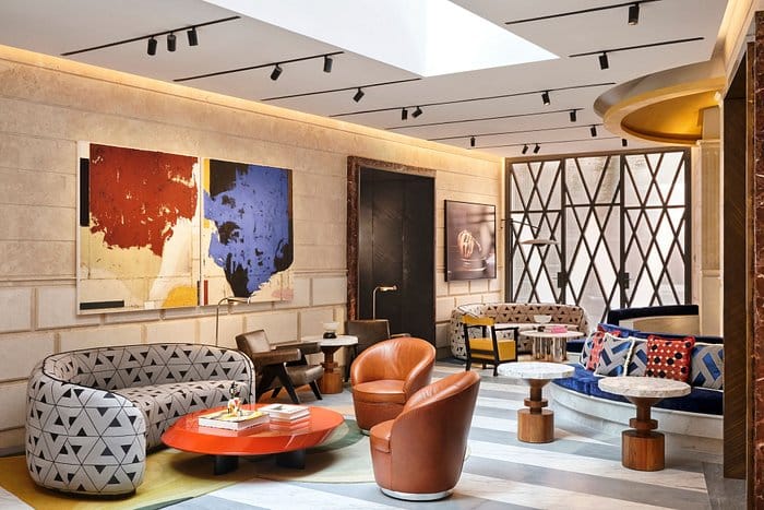 W Rome VIP suite with lounge seating for intimate business meetings and networking events.