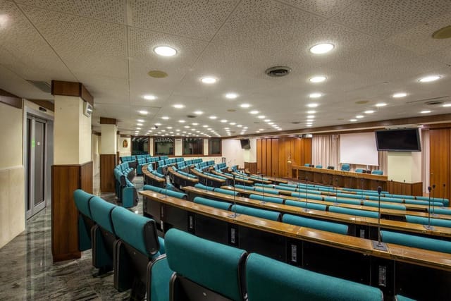Anfiteatro Room at Villa Aurelia: Tiered auditorium seating for corporate lectures and events.