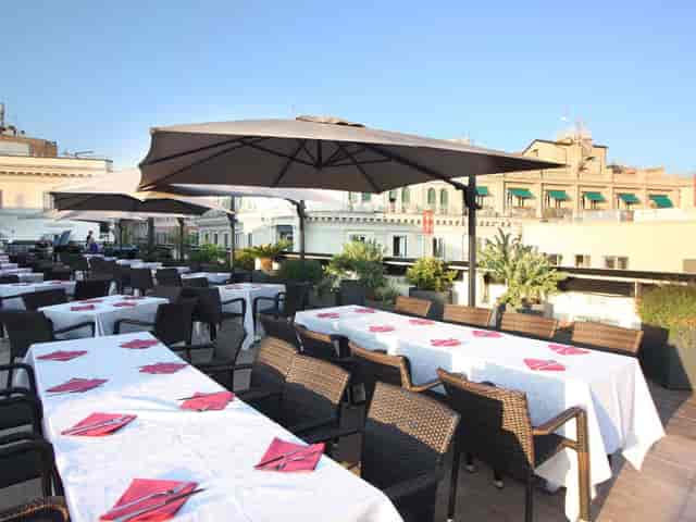 Rooftop bar venue at The Hive with formal dining tables for corporate networking events.