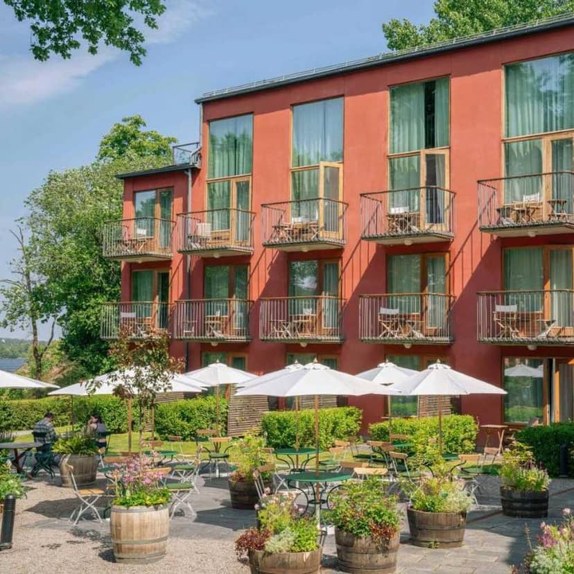 Boutique hotel room with private terrace for corporate retreats and outdoor networking events.