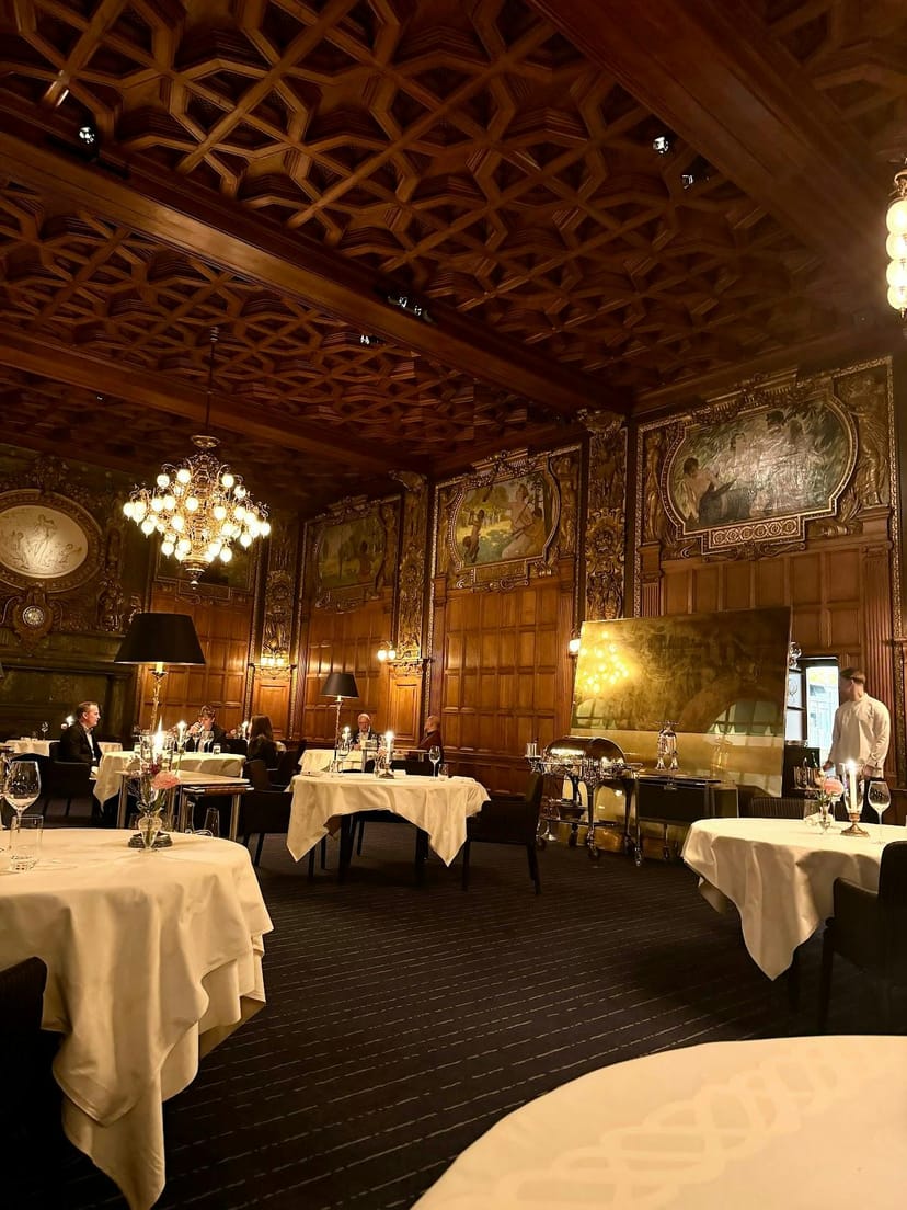 Historic Stockholm private dining room with ornate wood paneling for luxury gala events.