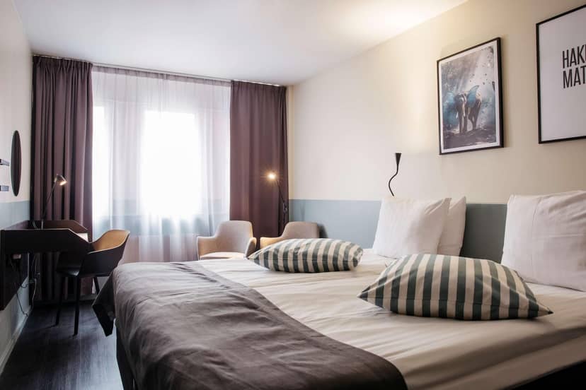 Best Western Kom Hotel guest room with workspace for business travel and corporate events.