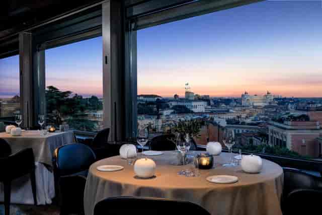 Elegant Hotel Eden piano bar with sunset views, ideal for executive dinners and VIP receptions.