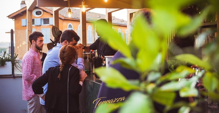 Rooftop bar networking event at Hotel Parrasio featuring intimate lighting and stylish atmosphere.