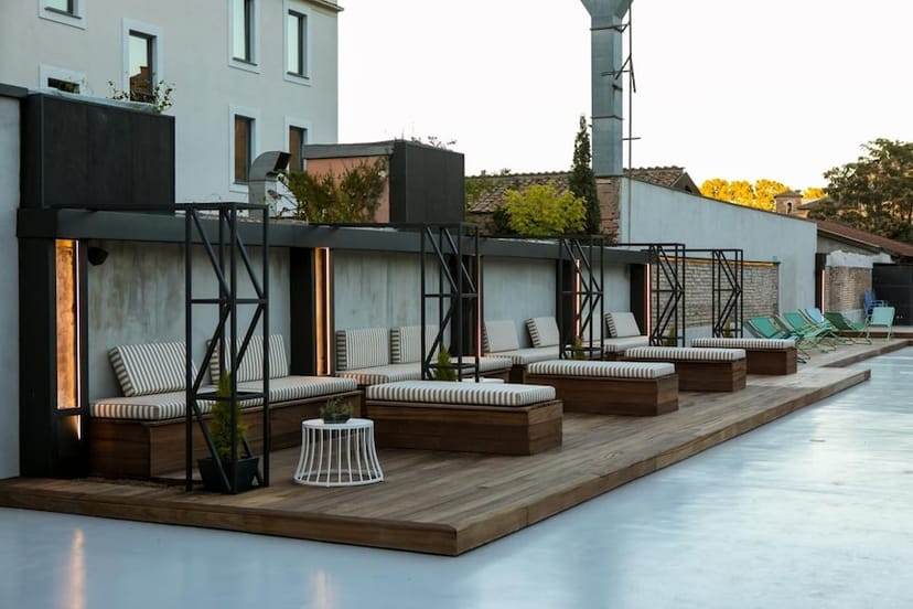 Modern rooftop terrace with modular timber seating for corporate cocktail and networking events.