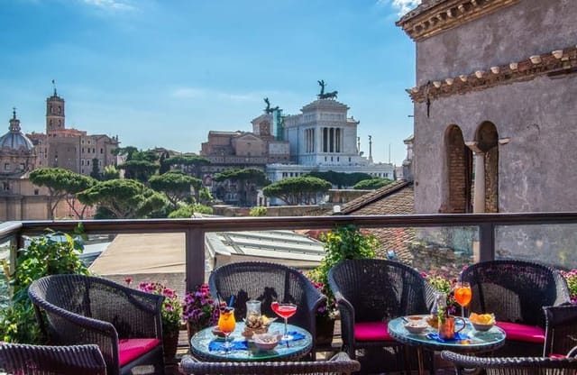 Executive reception at Hotel Forum terrace with iconic Roman views for corporate events.