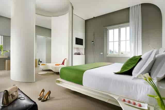 Modern premium hotel suite at Palazzo Montemartini, perfect for VIP speaker events or incentive travel.